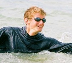 surf swimming in a t-shirt