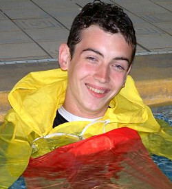 Lifeguard wears anorak in swimmingpool
