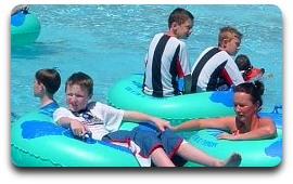 Group swimming in T-shirt in a pool
