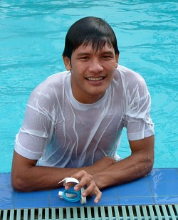 Swimming in t-shirt in pool with goggles
