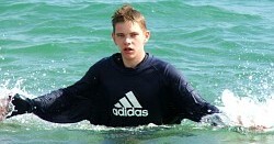 swimming in a sweatshirt
